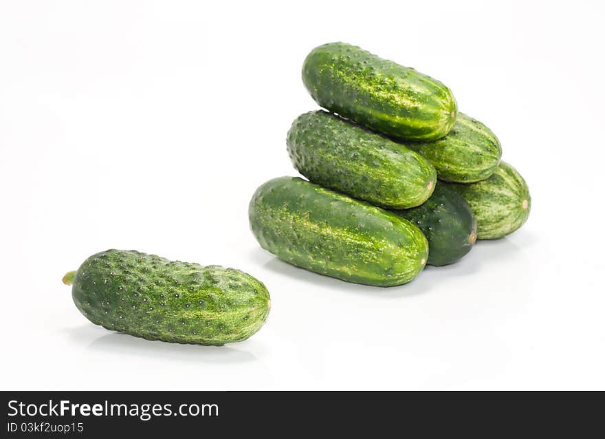 One and a few green cucumbers