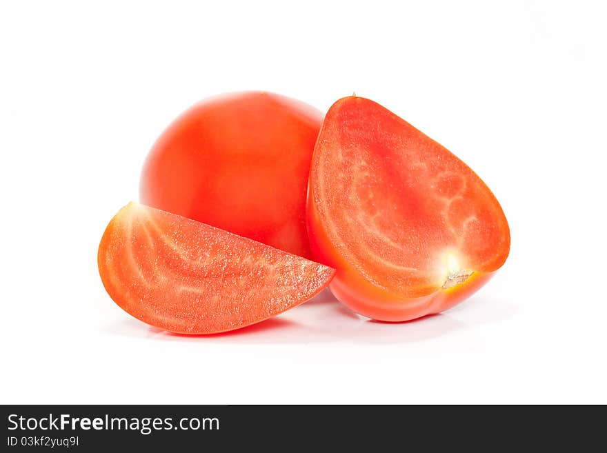 Cut and whole red tomatoes