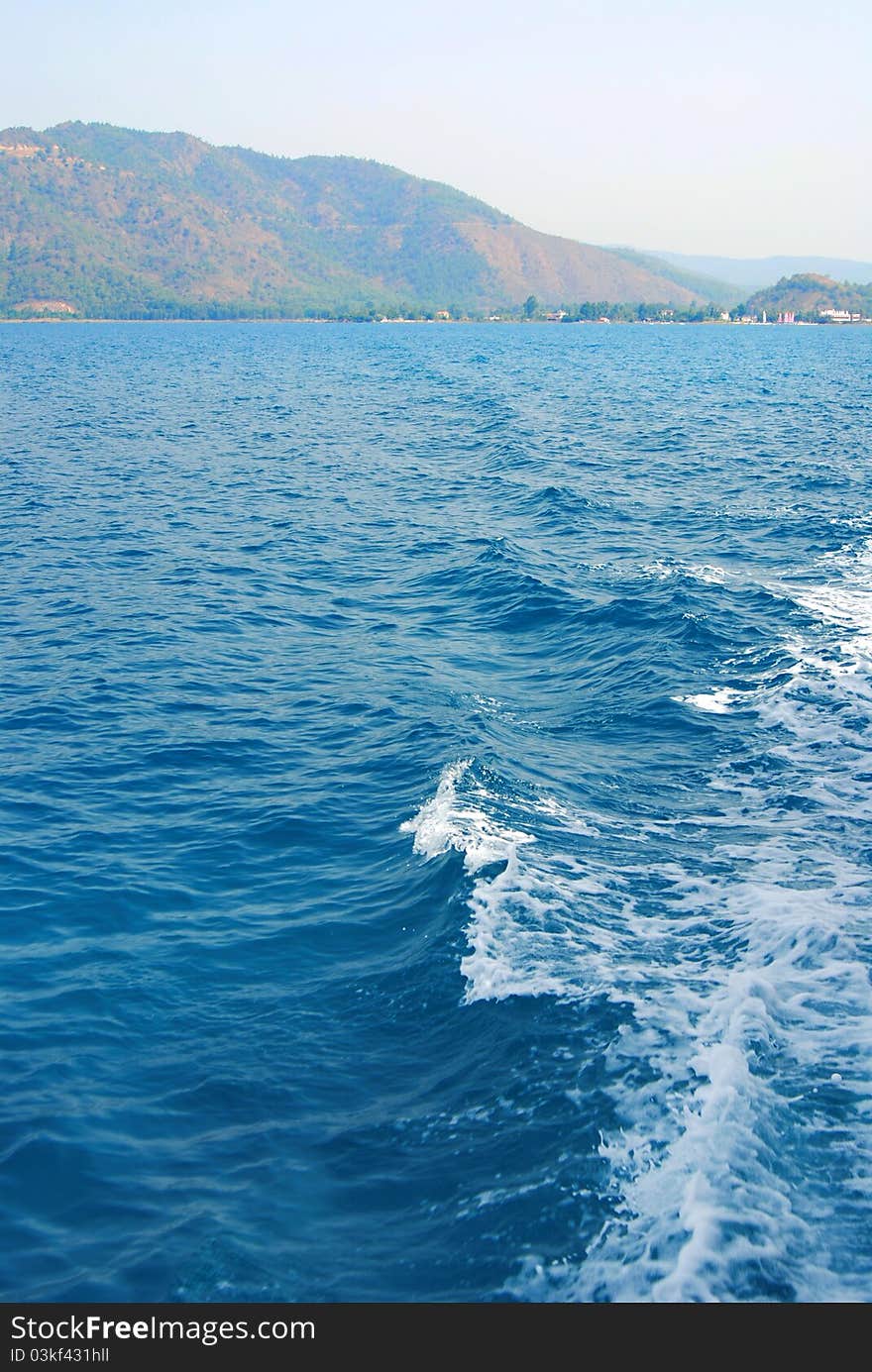 Landscape. Sea, waves and mountains