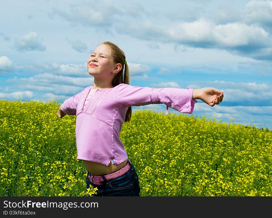 The girl on a green meadow