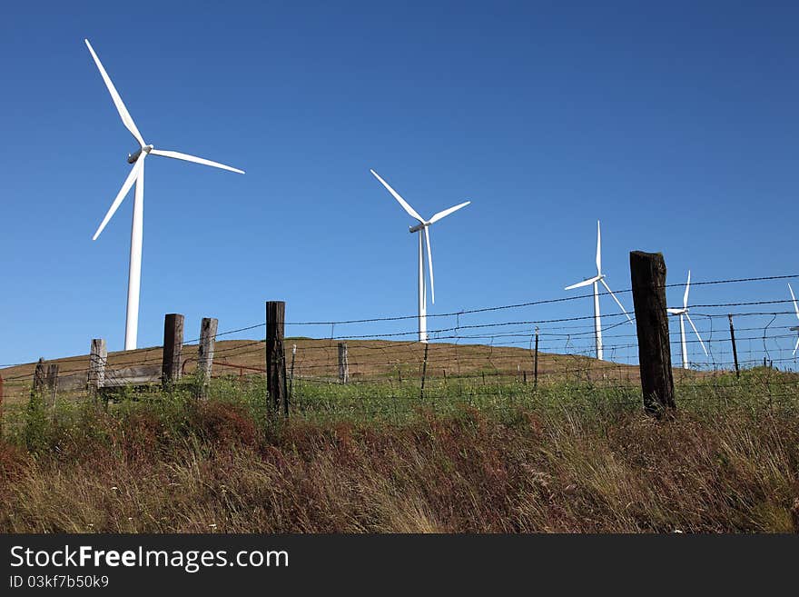 Wind turbines on a hill in rural Washington state. Wind turbines on a hill in rural Washington state.