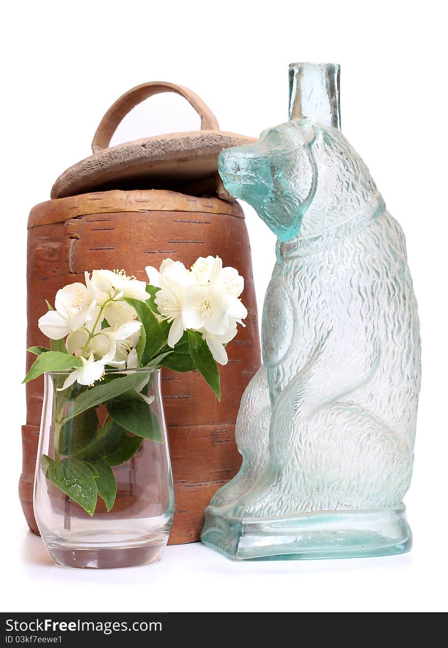 Color photo of a vase made of birch bark and a bouquet of jasmine. Color photo of a vase made of birch bark and a bouquet of jasmine