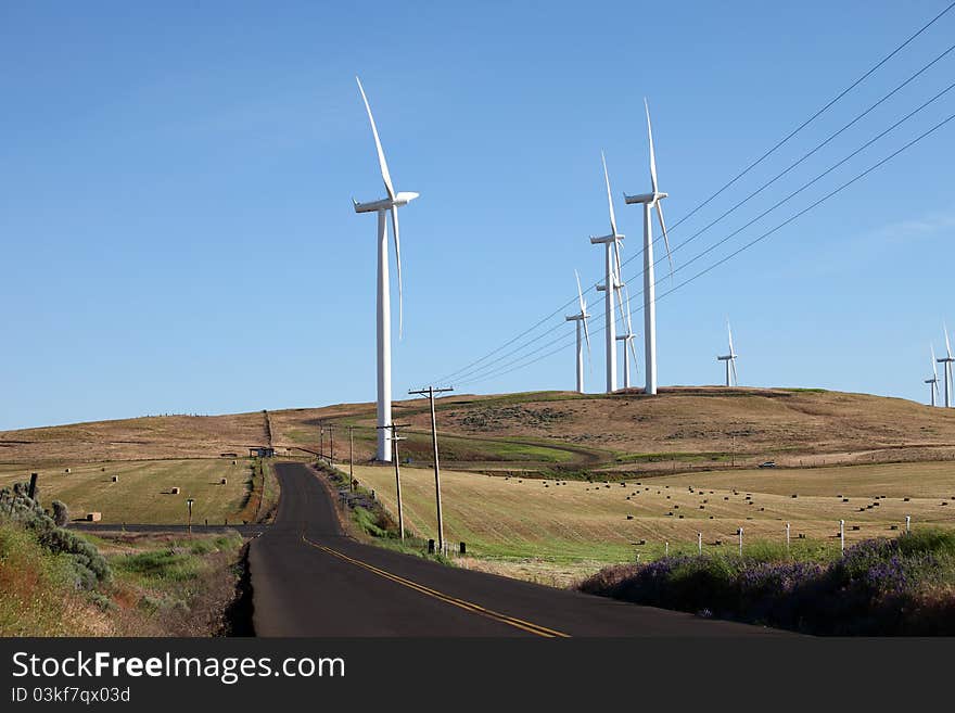 Wind turbines along the hills in rural Washington state. Wind turbines along the hills in rural Washington state.