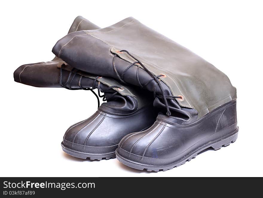 Color photograph of rubber boots on a white background