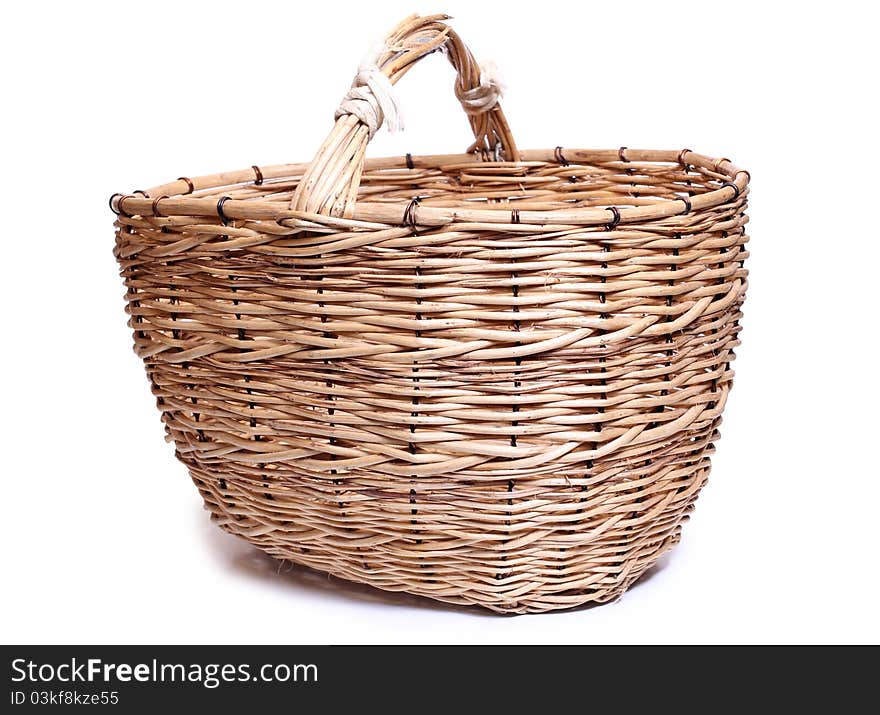 Color photo of wicker basket on a white background