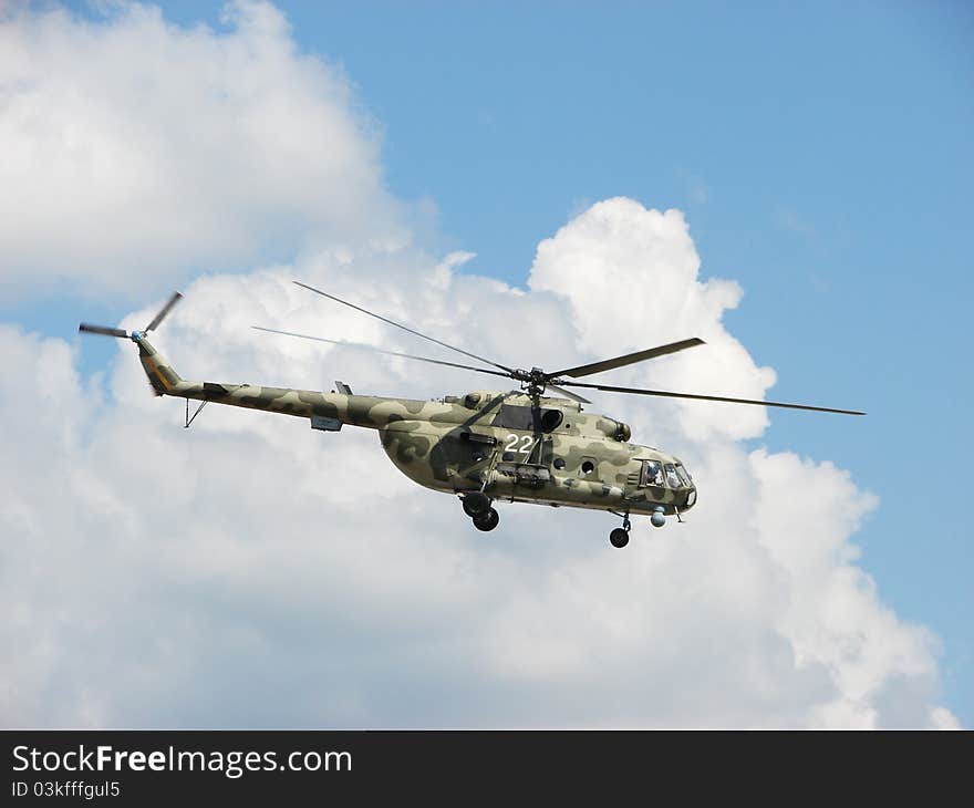 Helicopter in the background of clouds