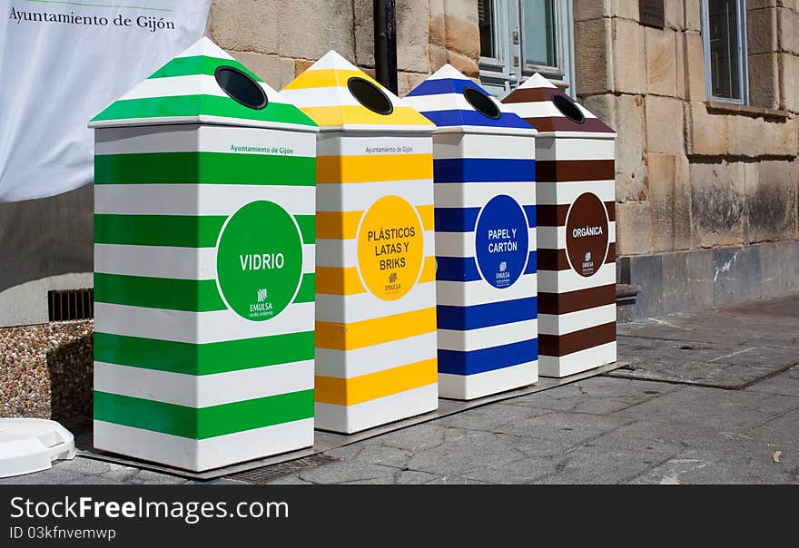 Four containers for recycling paper, metal, plastic and glass - Gijon, Asturias