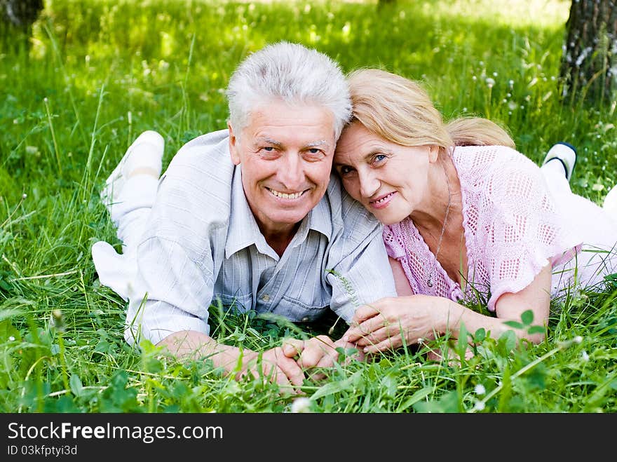 Happy old couple playing at the nature. Happy old couple playing at the nature