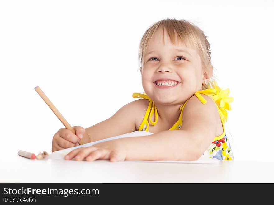 Little girl draws on a white background