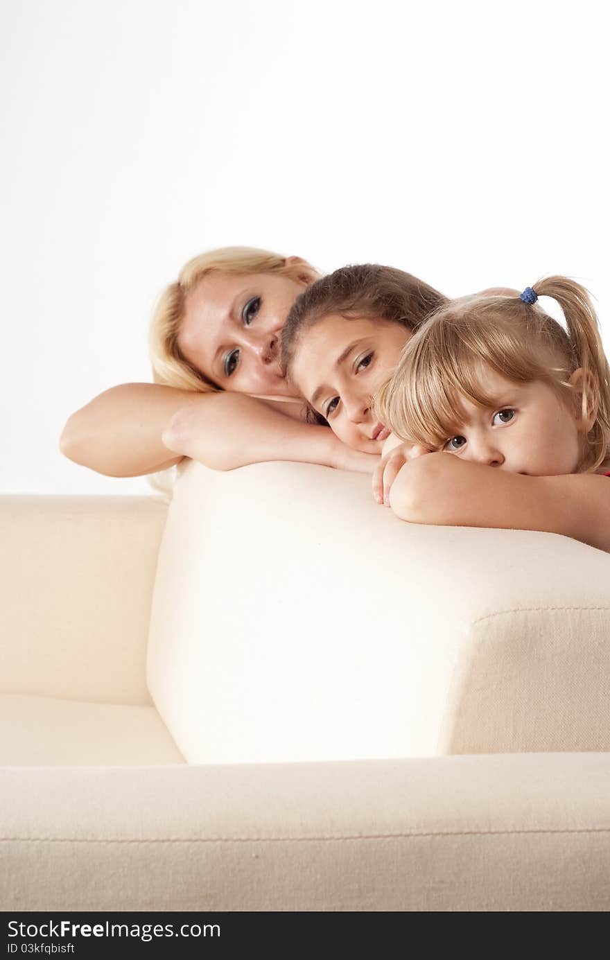 Three girls posing on a white background. Three girls posing on a white background