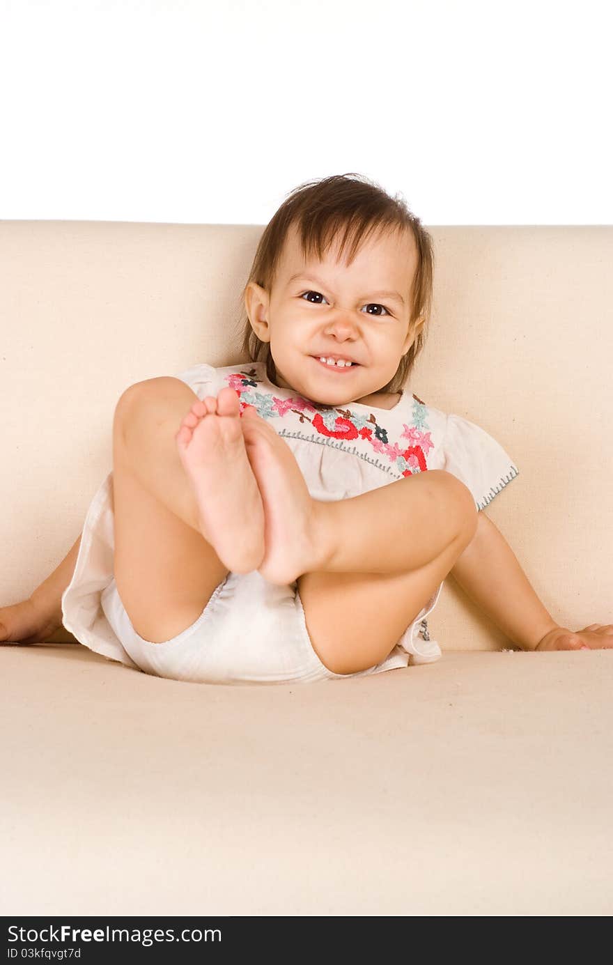 Funny baby at sofa