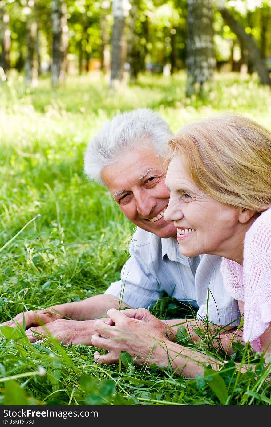 Happy old couple playing at the nature. Happy old couple playing at the nature