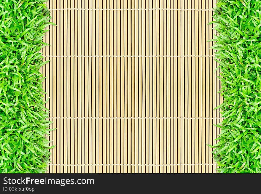 Grass frame on bamboo background texture