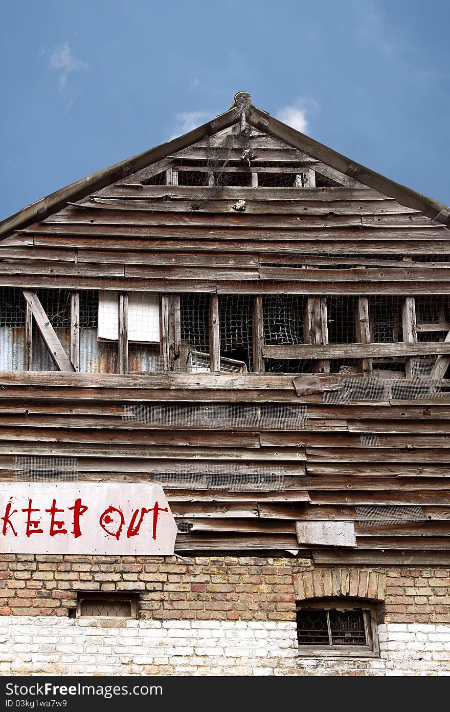 Derelict building with keep out sign