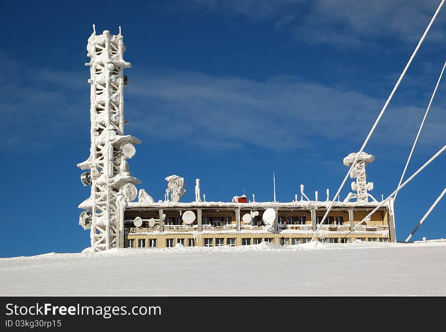 TV transmitter on snowy mountains, winter landscape Slovakia