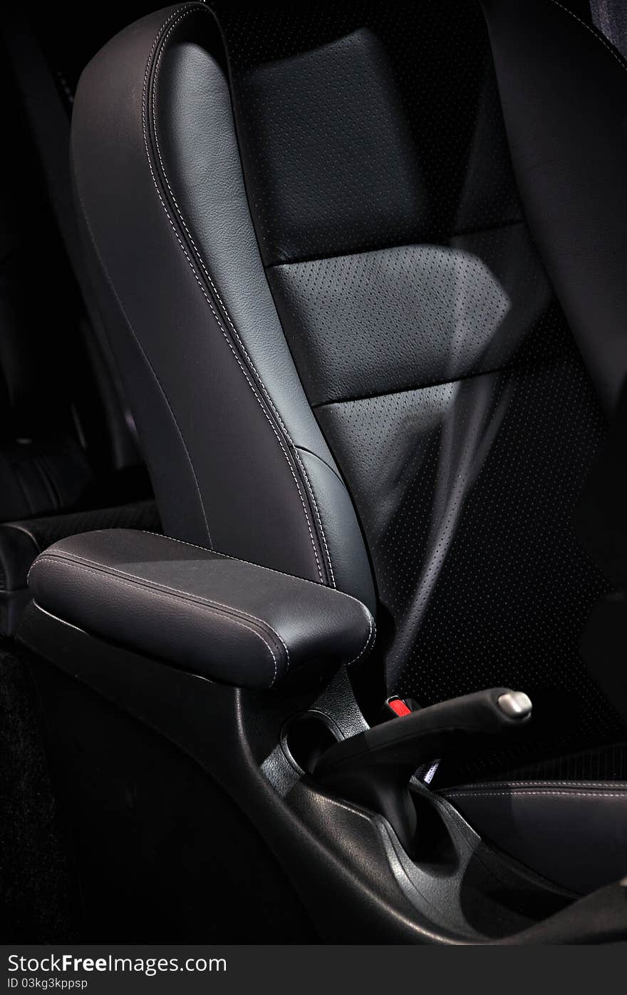 Part and detail of sedan interior setting and decoration, which is diver seat and arm rester, shown as functional design of car and luxury configuration.