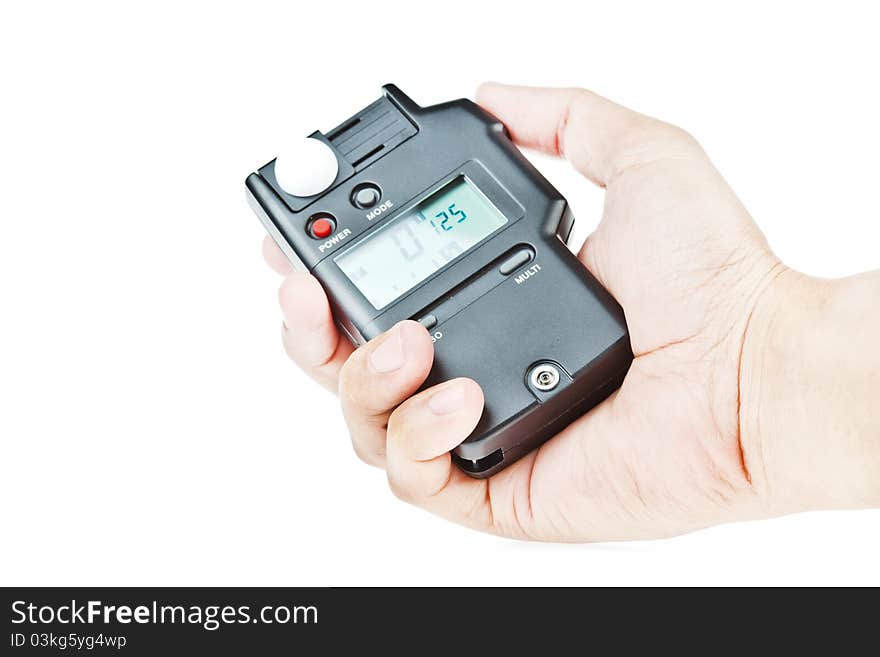 Hand holding lightmeter isolated on white background