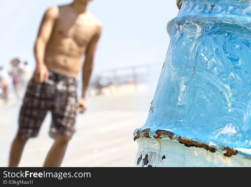 Male promenading beach