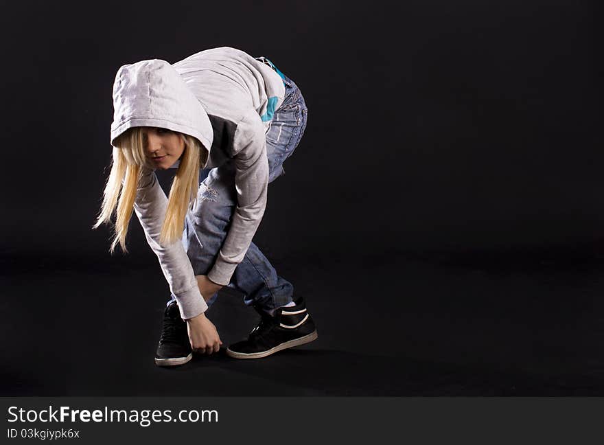 Modern dance, hip hop girl dancer on a black background. Modern dance, hip hop girl dancer on a black background.