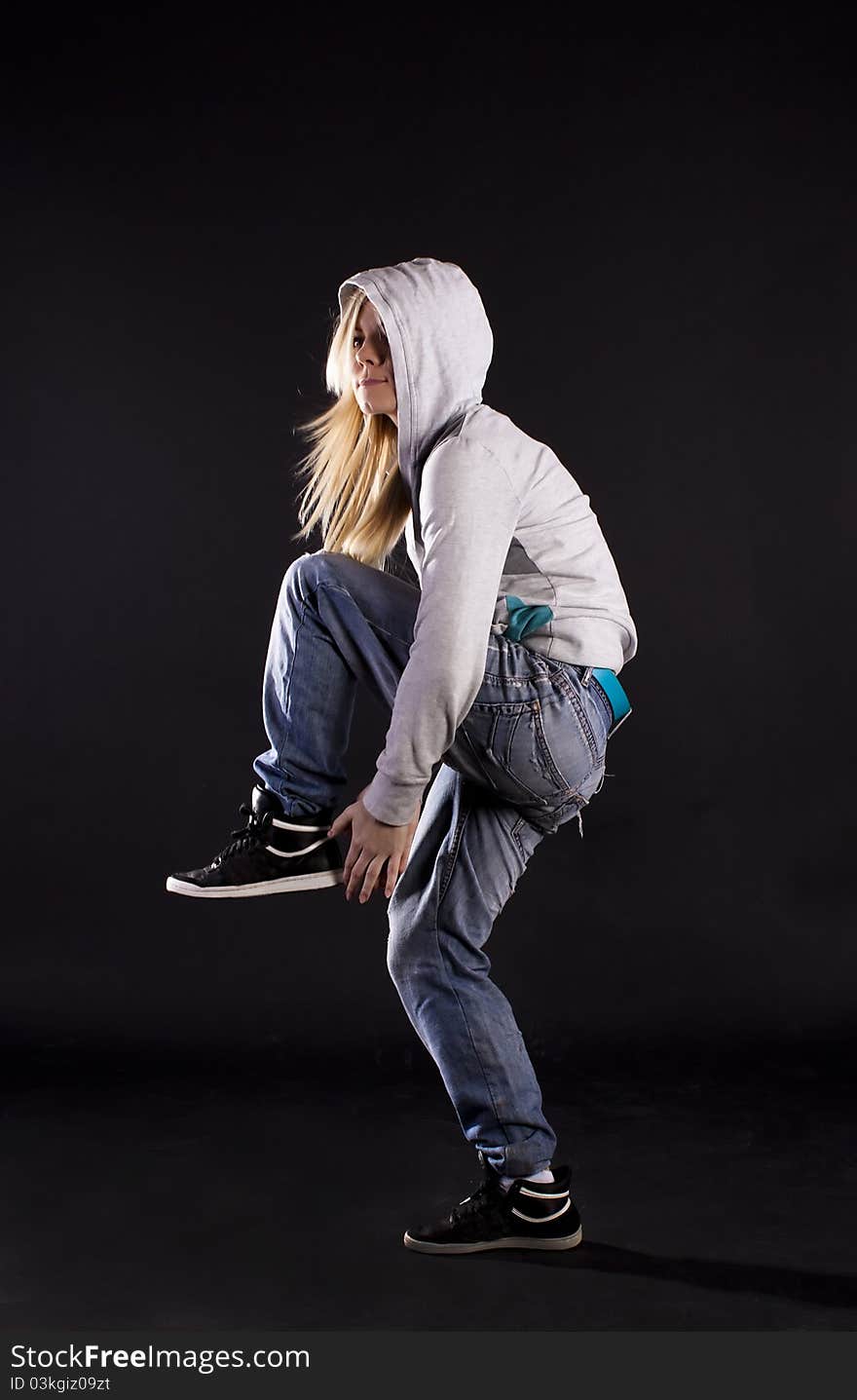 Modern dance, hip hop girl dancer on a black background. Modern dance, hip hop girl dancer on a black background.