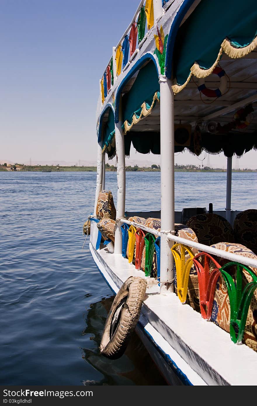 Many-coloured ferry with a kind on horizon. Many-coloured ferry with a kind on horizon.