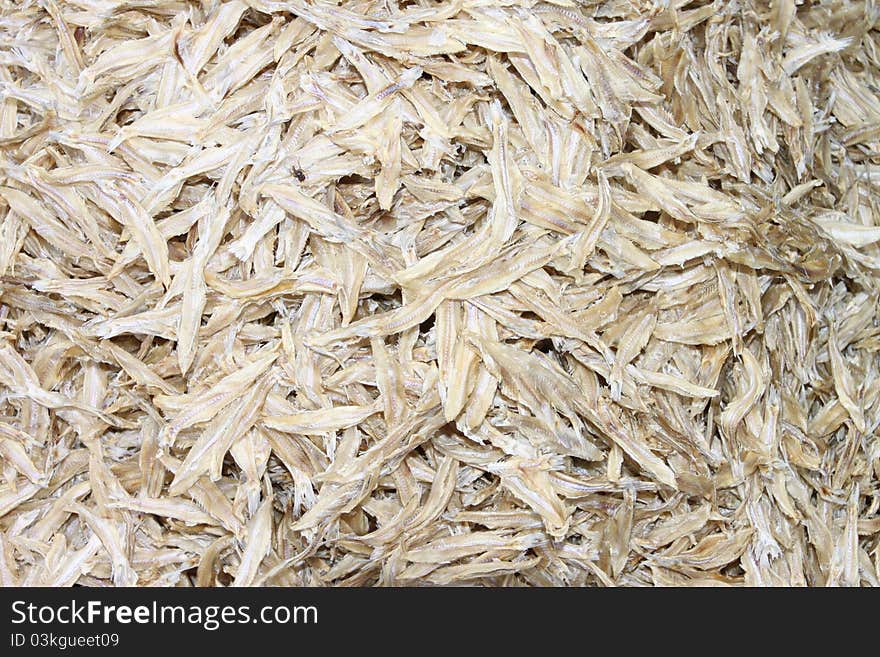 A picture of dried salted fishes in sunlight