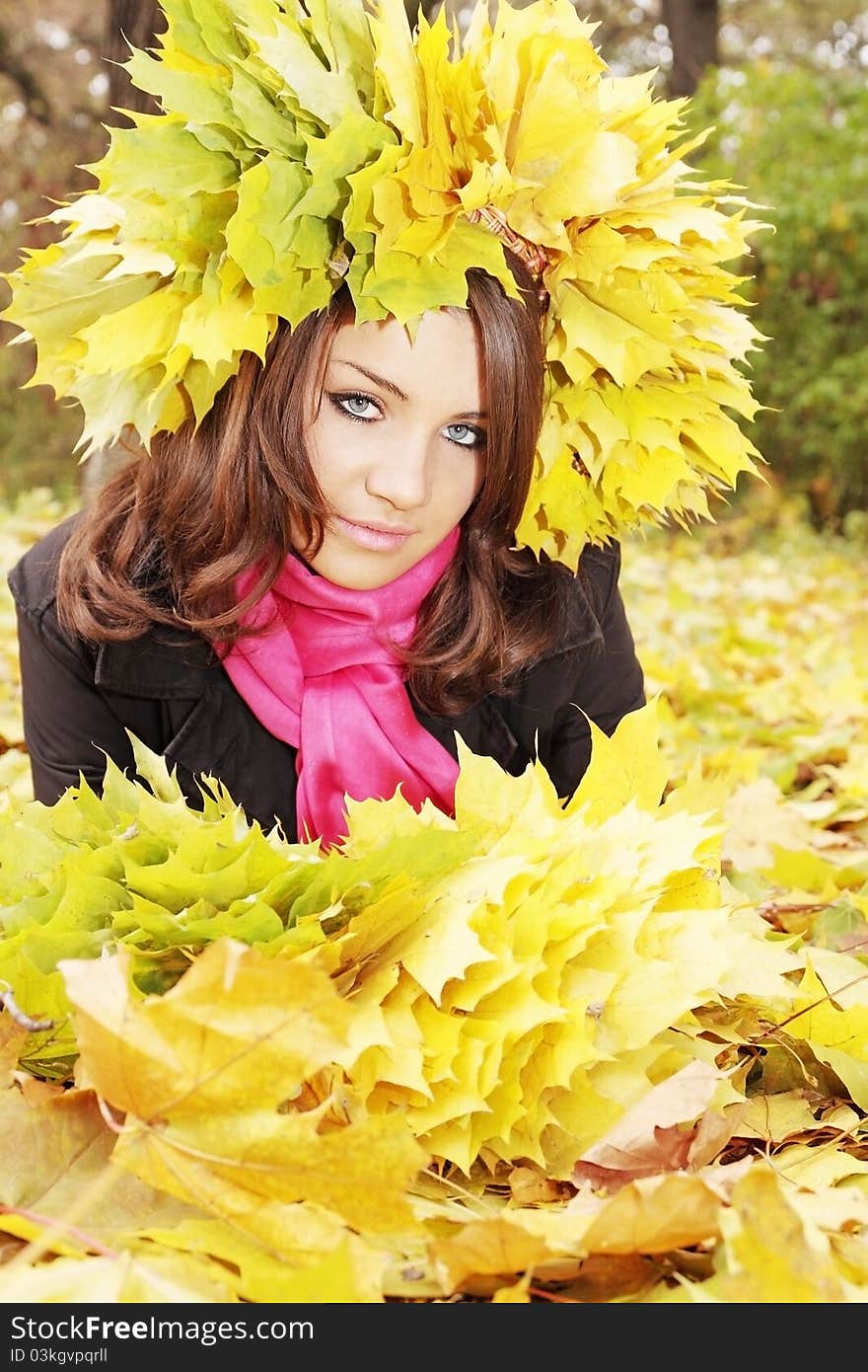 Beautiful woman in the wreath from yellow leaves. Beautiful woman in the wreath from yellow leaves