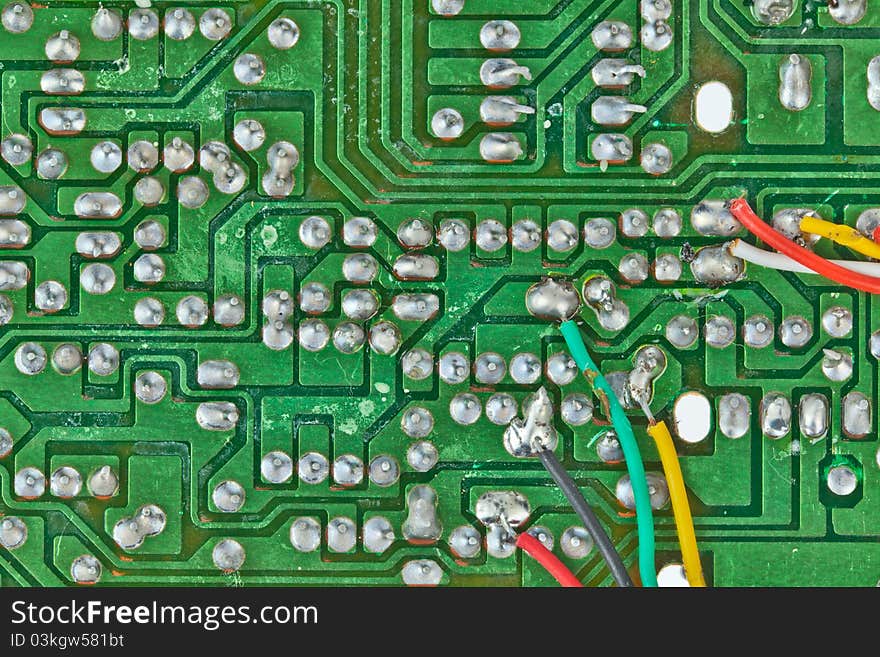 The printed-circuit board with electronic components macro background