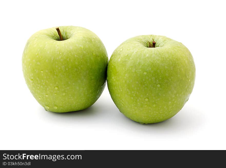 Two ripe green apples isolated on a white background