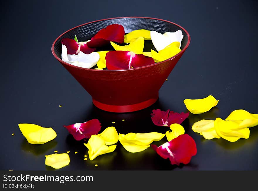 Red towels with flower and candle on black background. Red towels with flower and candle on black background