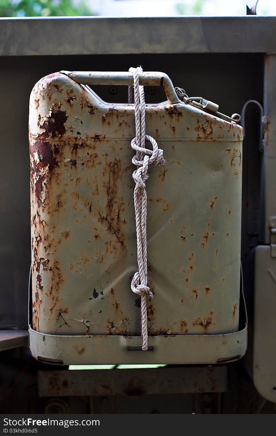 Old rust reserve canteen behind army car