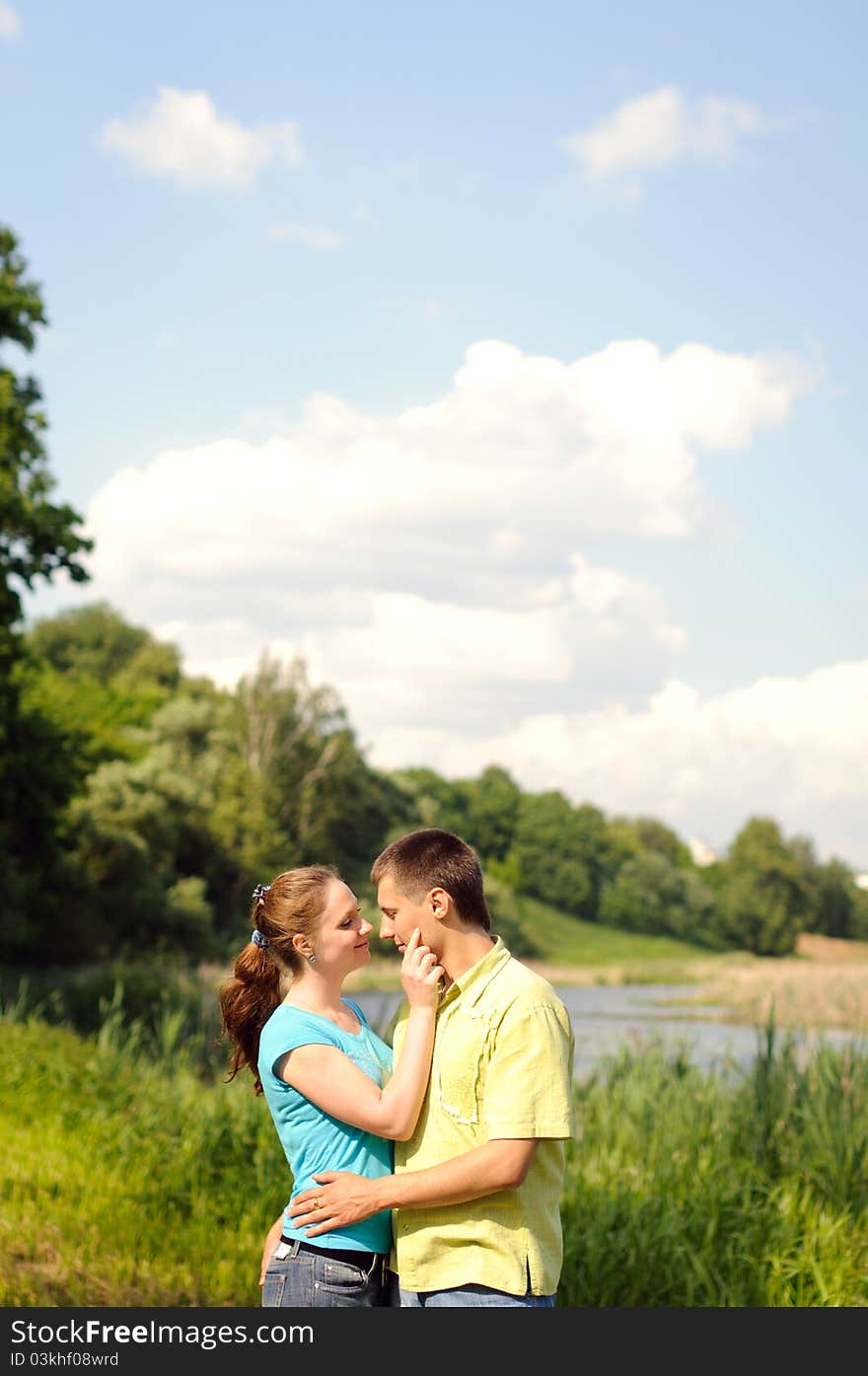 Adorable man and woman hug and enjoy nature. Adorable man and woman hug and enjoy nature