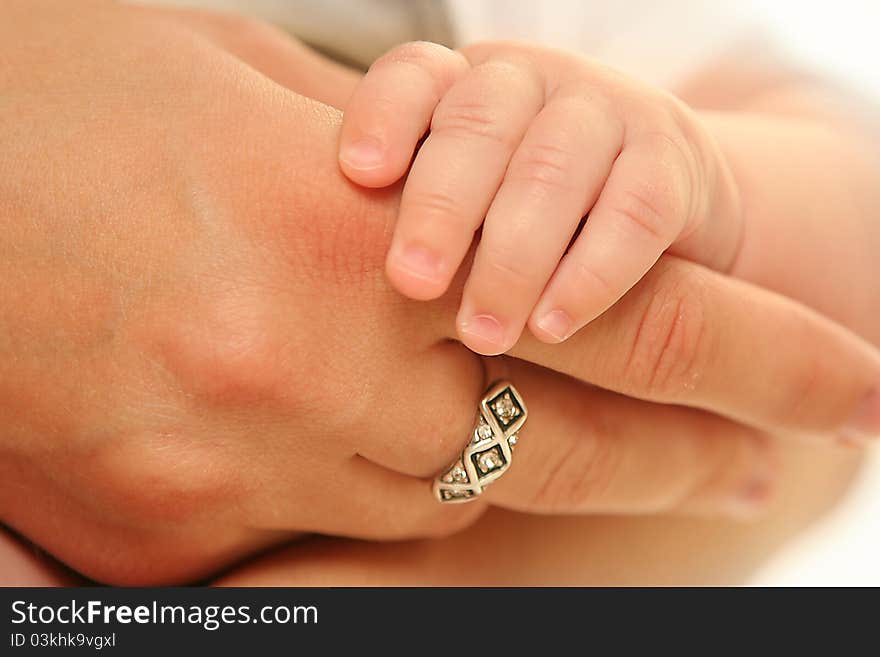 Little baby holding mother's hand. Little baby holding mother's hand