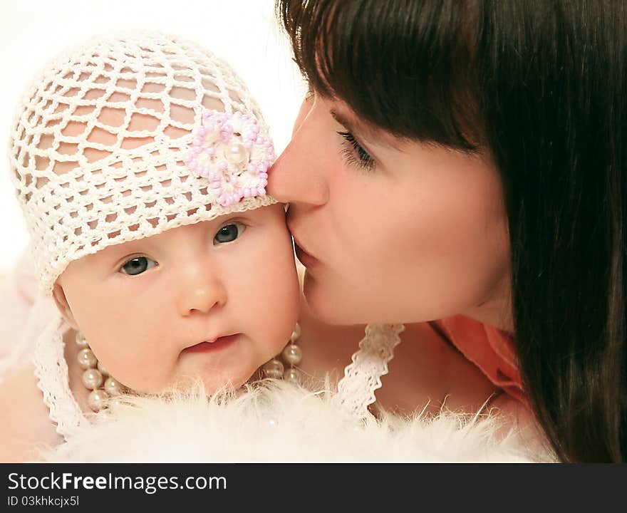 Young mother with baby on white background. Young mother with baby on white background