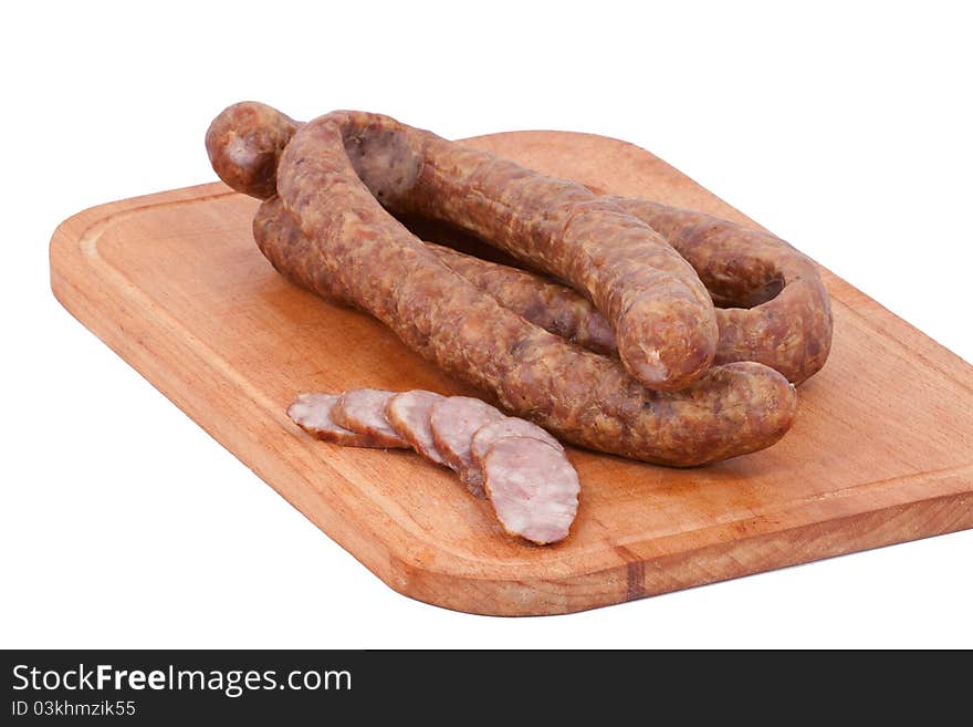 Meat delicatessen on the board isolated on the white