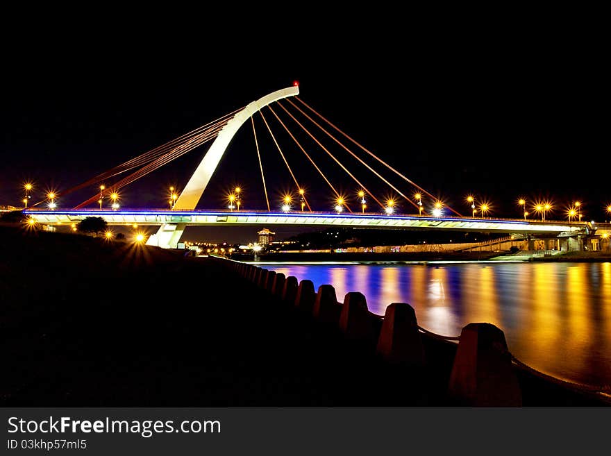 TaChih Bridge across river shinning at night in Taipei. TaChih Bridge across river shinning at night in Taipei