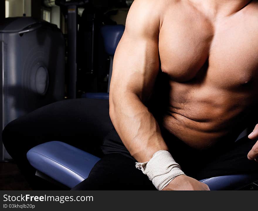 Muscular body in gym room. Muscular body in gym room