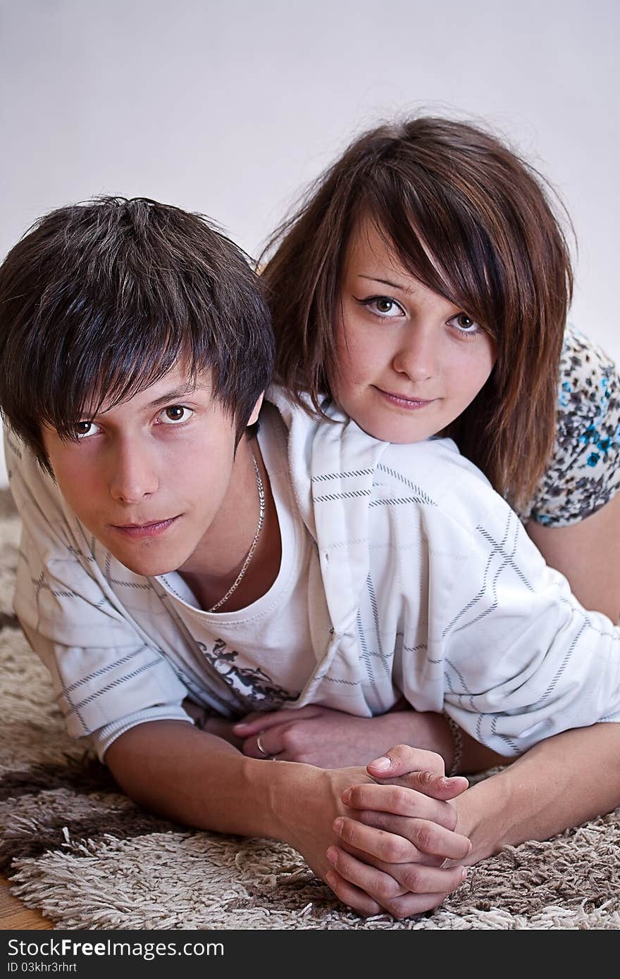 Happy young couple on the carpet