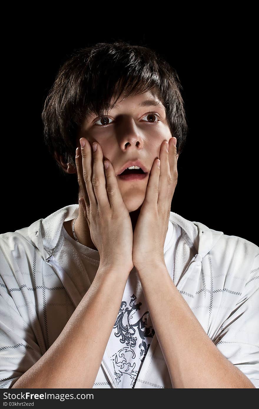 Very surprised young man. Isolated on black. Very surprised young man. Isolated on black.