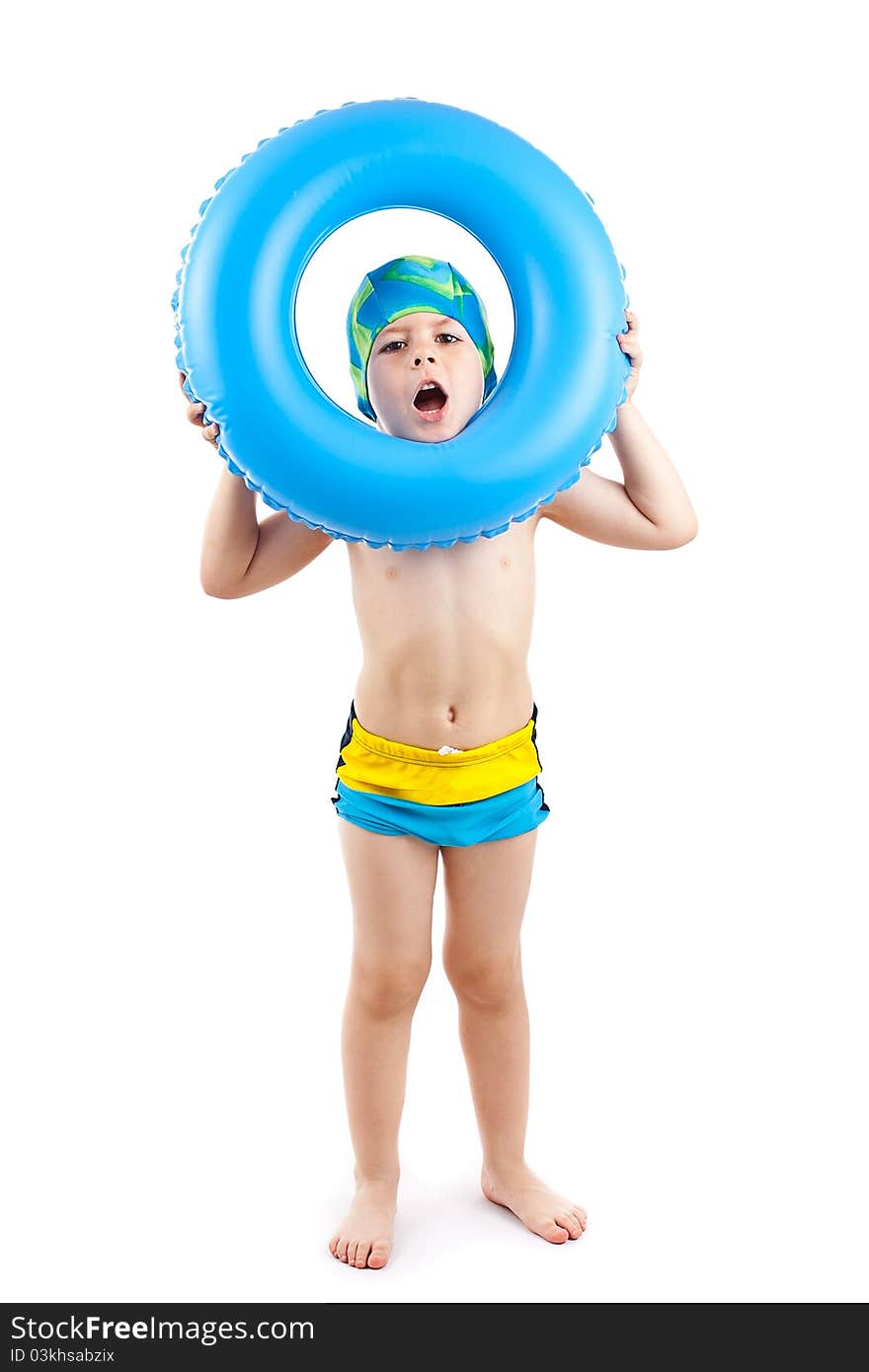 Funny little boy playing with blue life ring in swim caps, looking