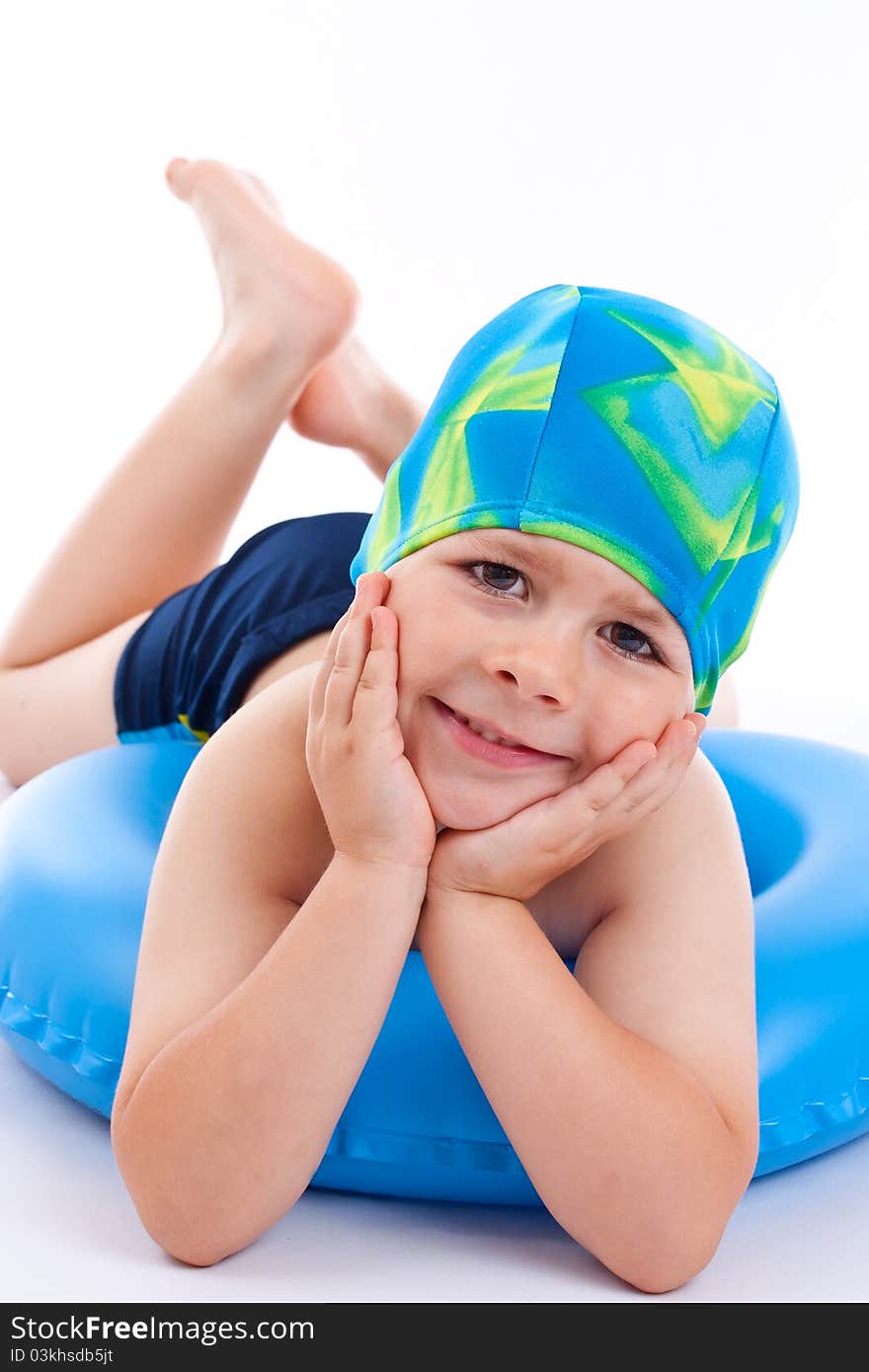 Funny little boy playing with blue life ring in swim caps, isolated in white