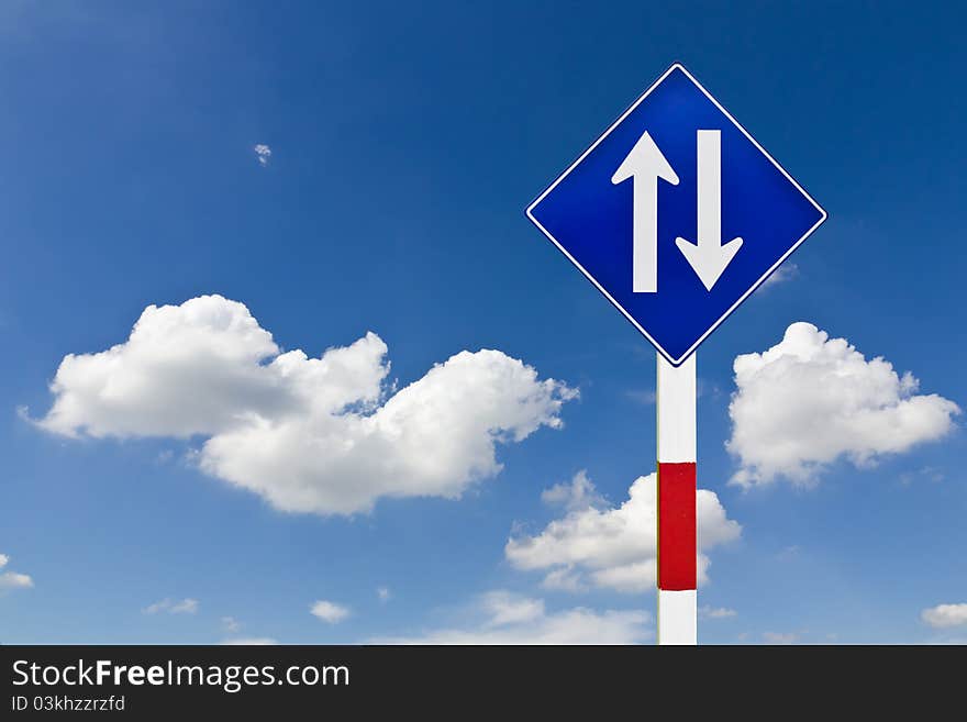 Curved Road Traffic Sign over blue sky