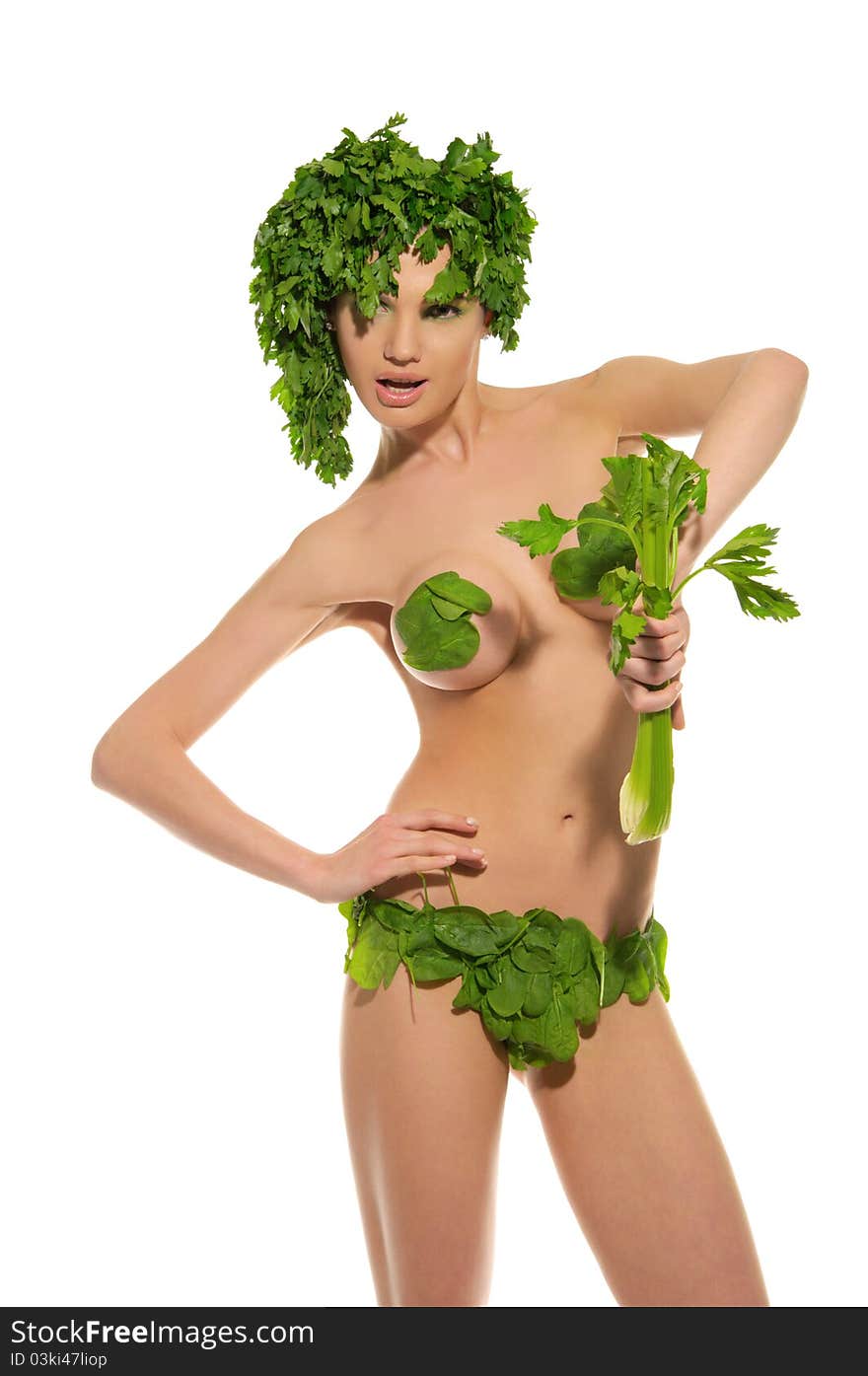 Sexy woman with clothes made of vegetables