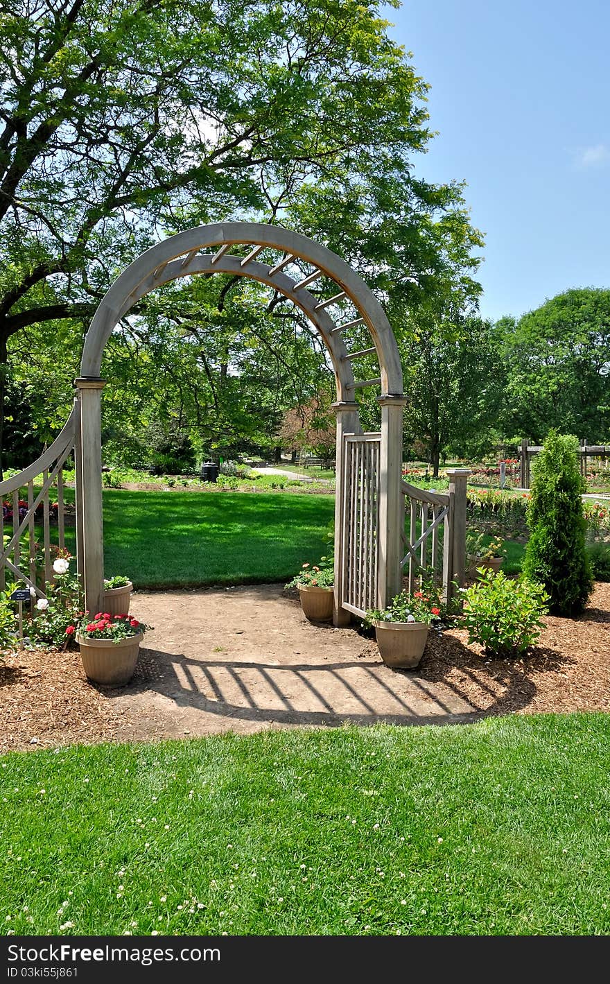 Wooden arch in formal garden. Wooden arch in formal garden