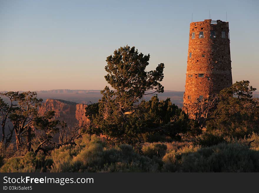 Sunset at the Desert View Watchtower (Grand Canyon Villlage, AZ). The four-story structure, completed in 1932, was designed by American architect Mary Colter. Her intention was to build a structure that would give the widest view of the Grand Canyon.