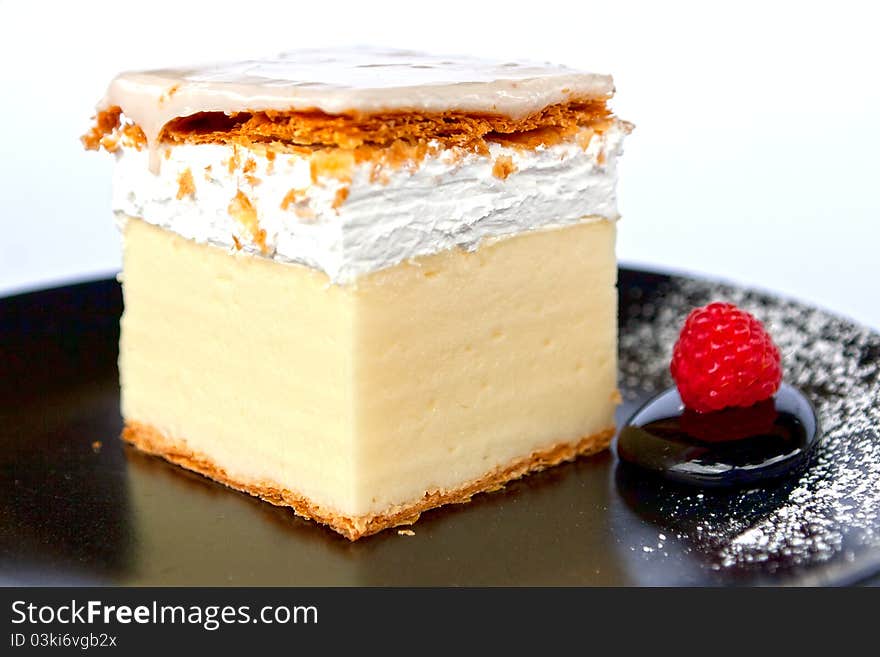 Creamy Cake On Black Plate