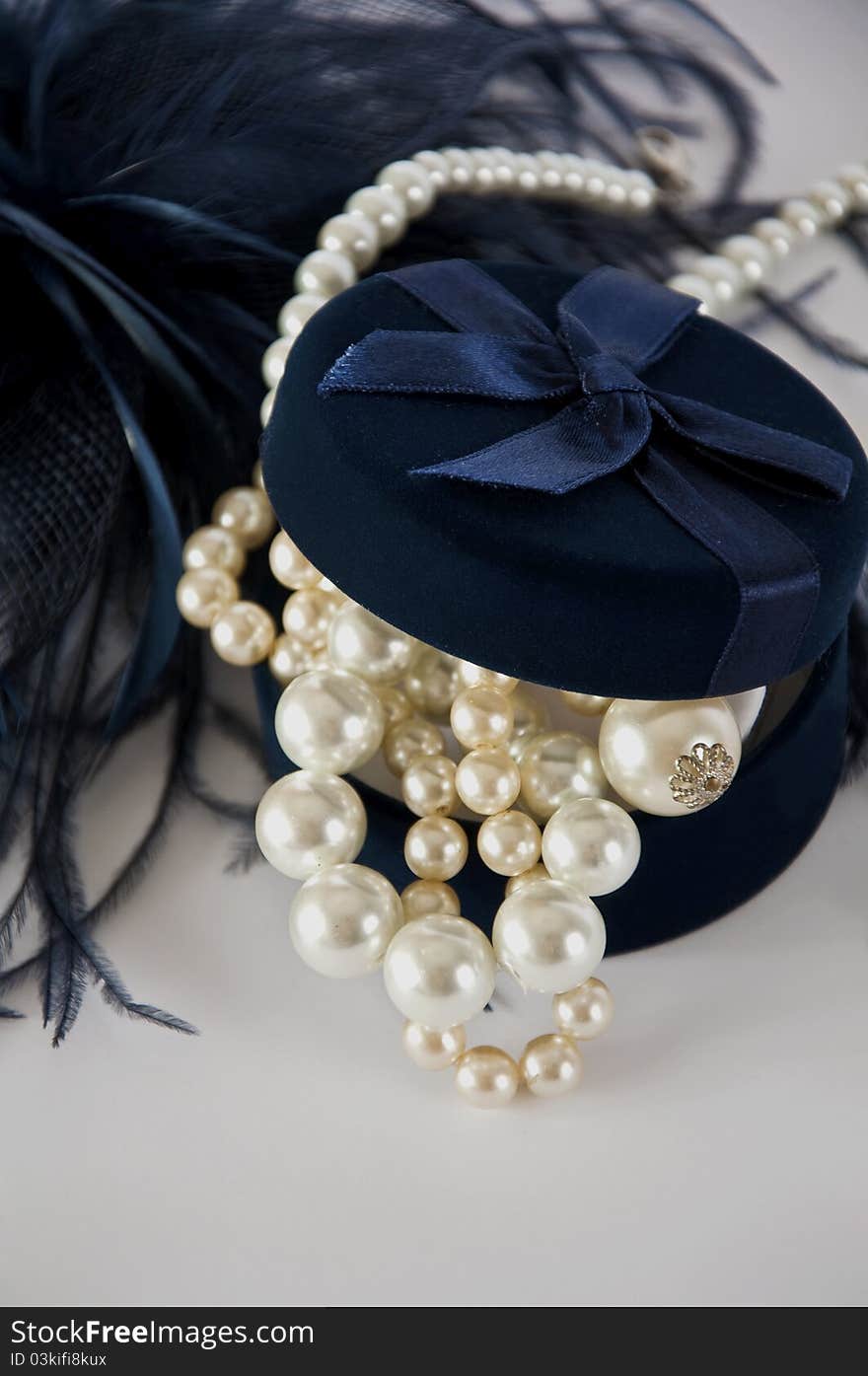 Dark blue casket with pearl beads