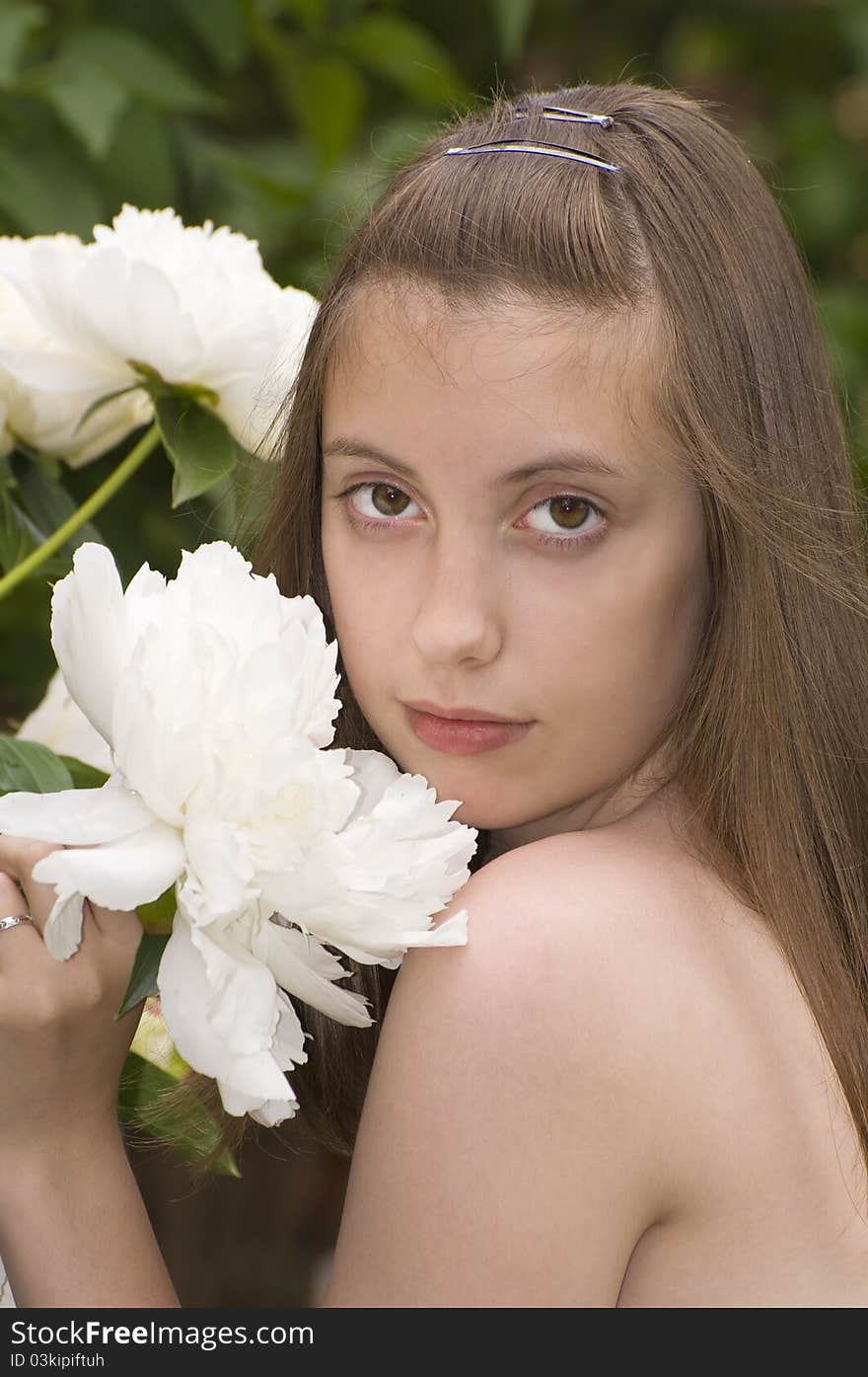 Portrate of pretty young girl with white peony. Portrate of pretty young girl with white peony