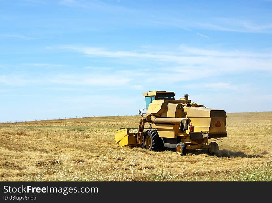 Combine harvester working a wheat field.