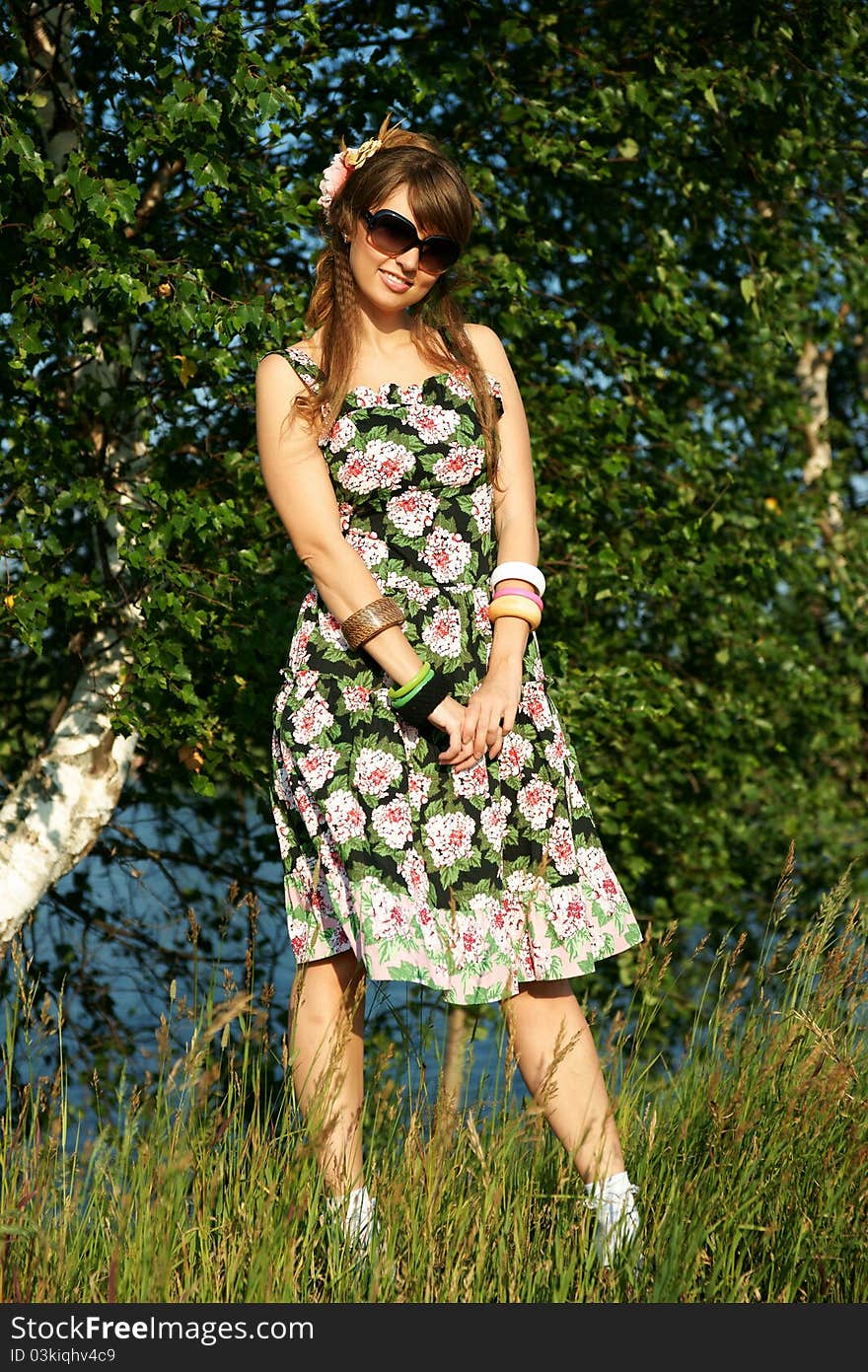 The beautiful girl against a birch